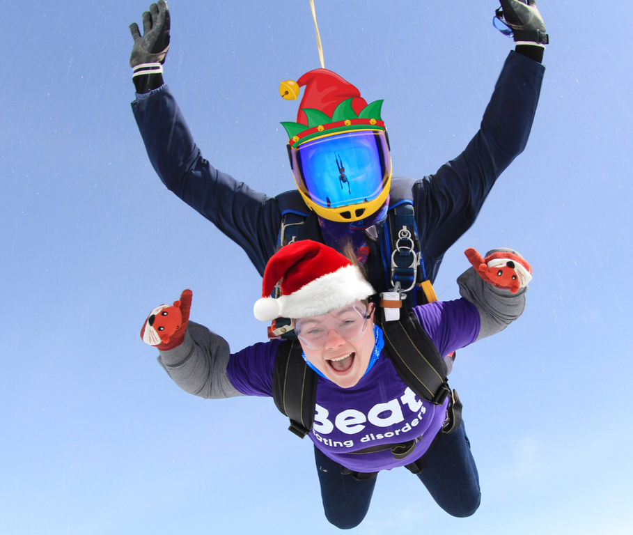 Tandem skydivers with festive hats