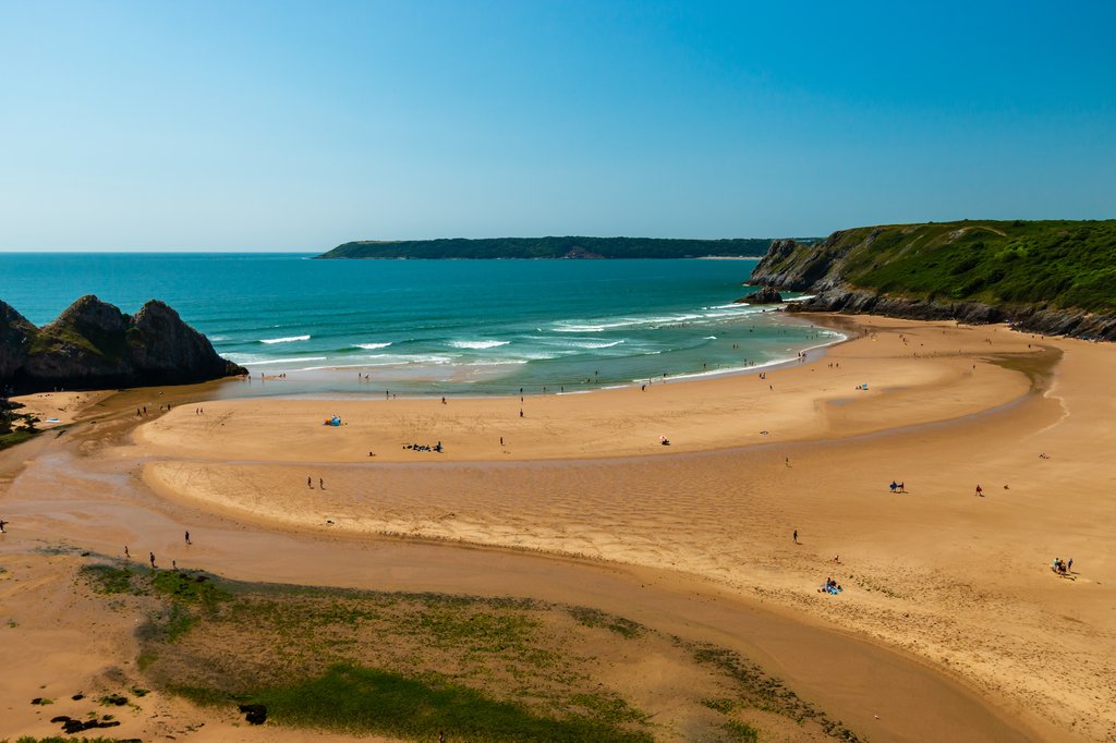 Photo of Gower Peninsula, looking out to the coast with a golden sandy beach